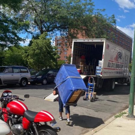 Mover uses hump strap to carry a large item that would have been too cumbersome without it